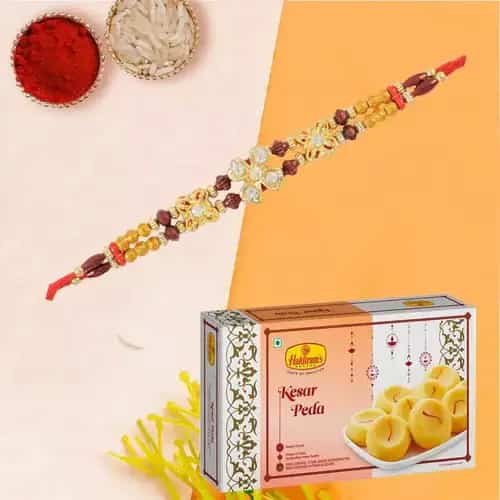 Dazzling Combination of Rakhi and Kesar Pedas with Roli Tilak N Chawal for Caring Brother