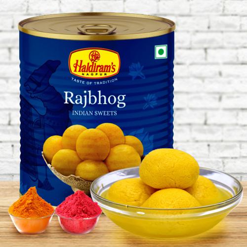 Nicely Gift Wrapped Rajbhog 1 Kg from Haldiram with free Gulal/Abir Pouch.